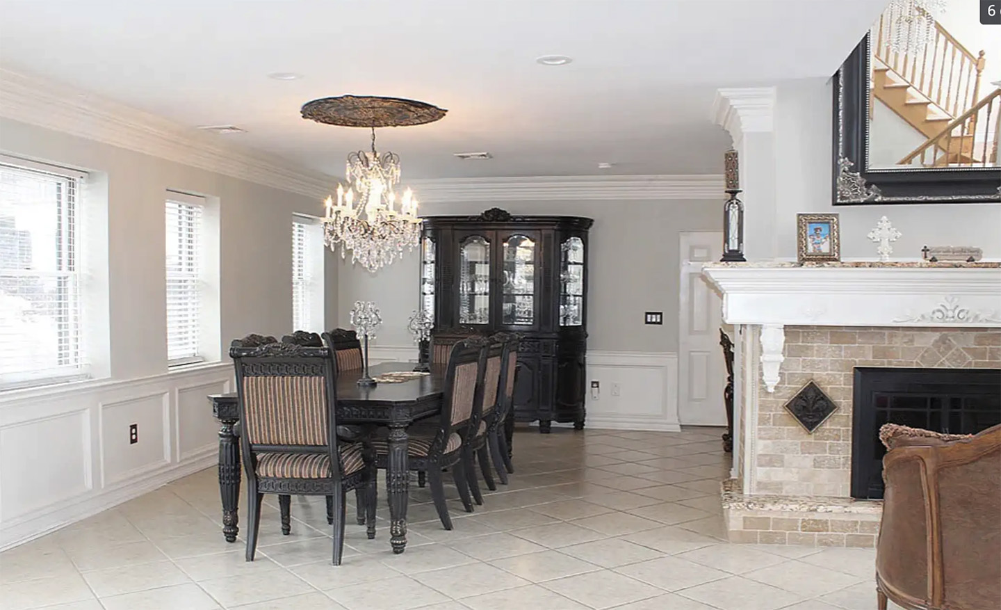 Living room with leather seating and chandelier